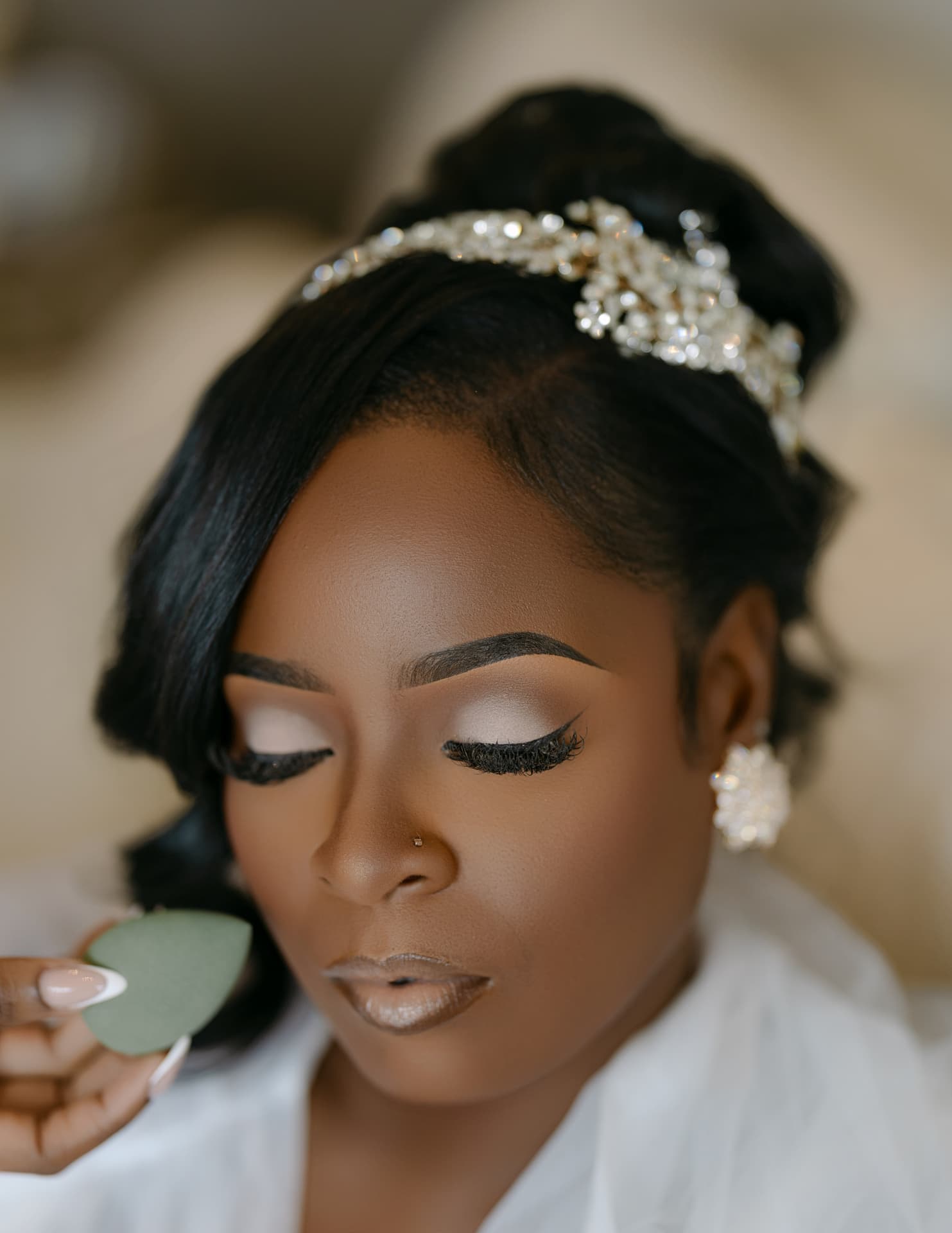 Close portrait of bridal makeup and a crystal headpiece